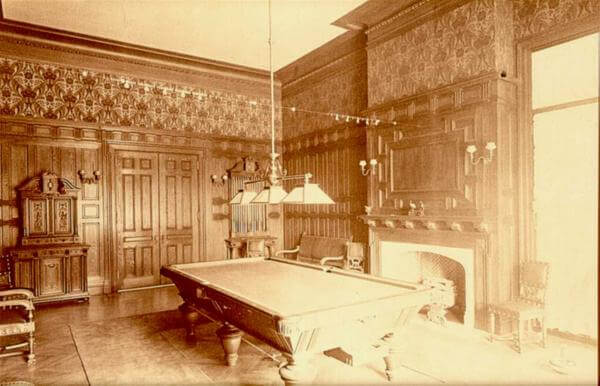 Photo of the chestnut paneled billiard room in the Guggenheim mansion